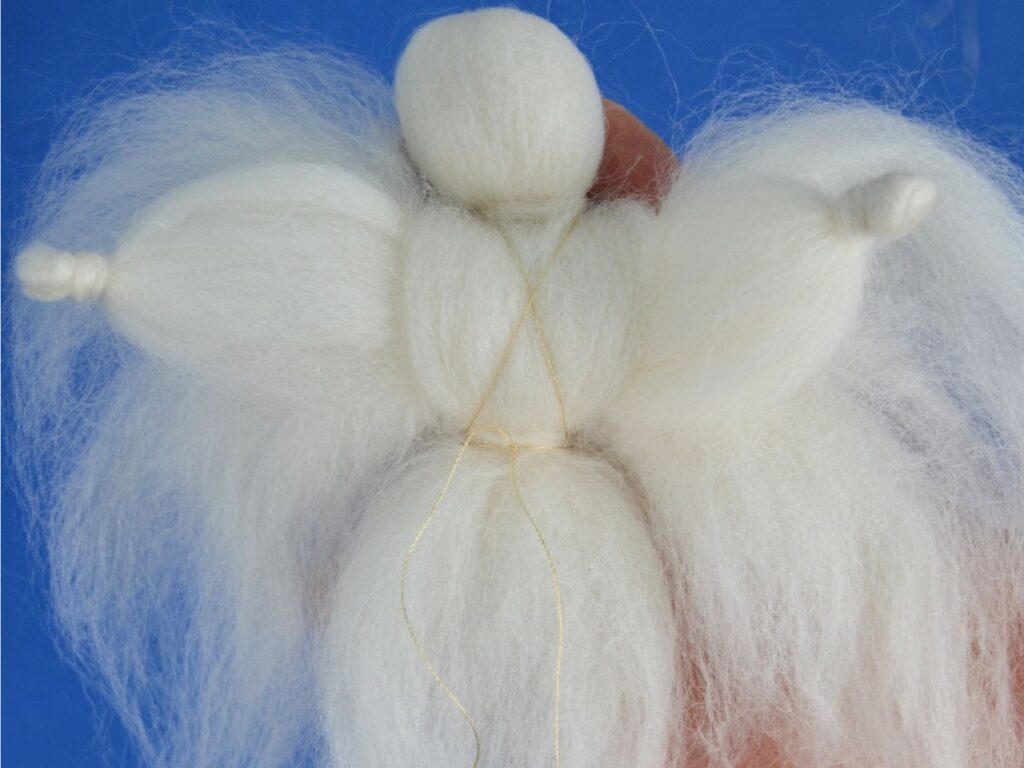 Wool Angel: A white angel with a Blue background.