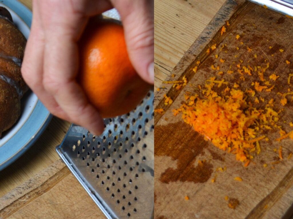 a hand grating a mandarin orange