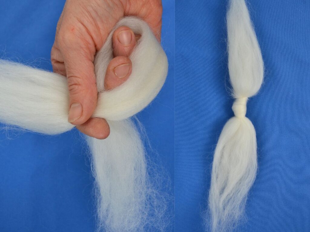 Step 2 wool angel: a hand making a knot with a piece of wool, and the wool around the knot.
Blue background