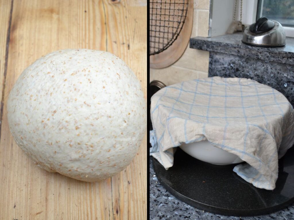 A ball of bread dough, a bowl cover with a cloth