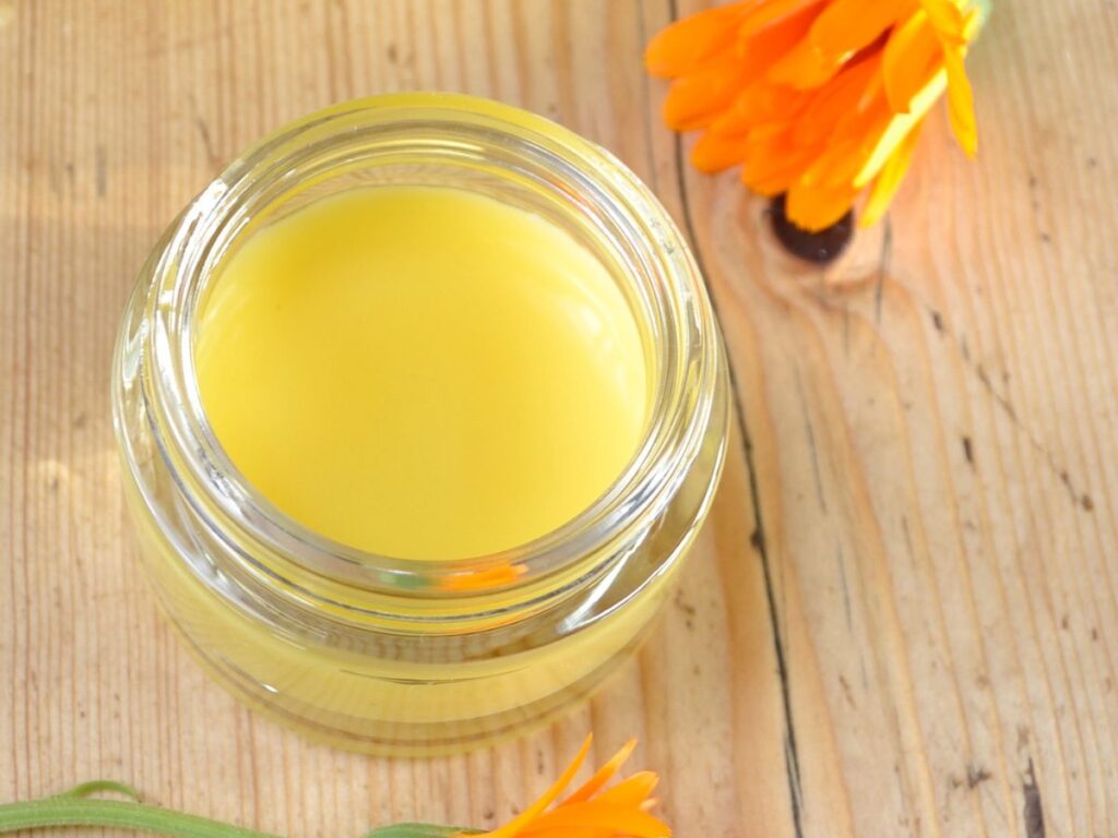 a cosmetic jar with just made calendula salve