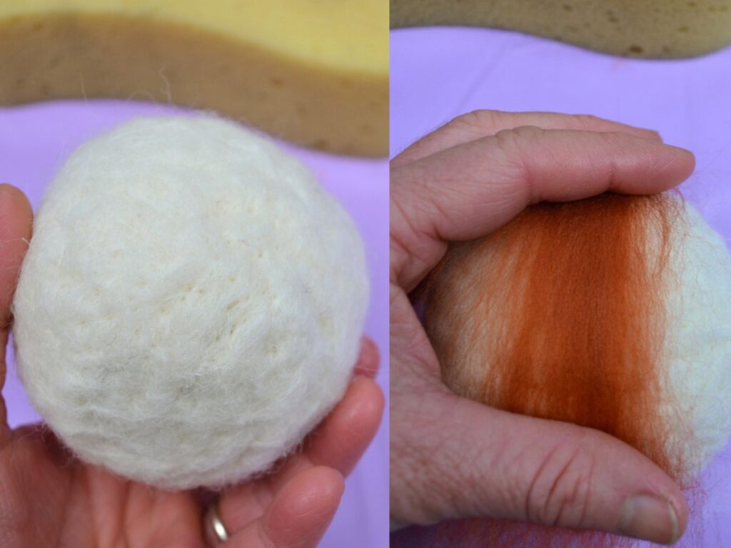 A hand holding a Needle felt ball and adding coloured wool to it.