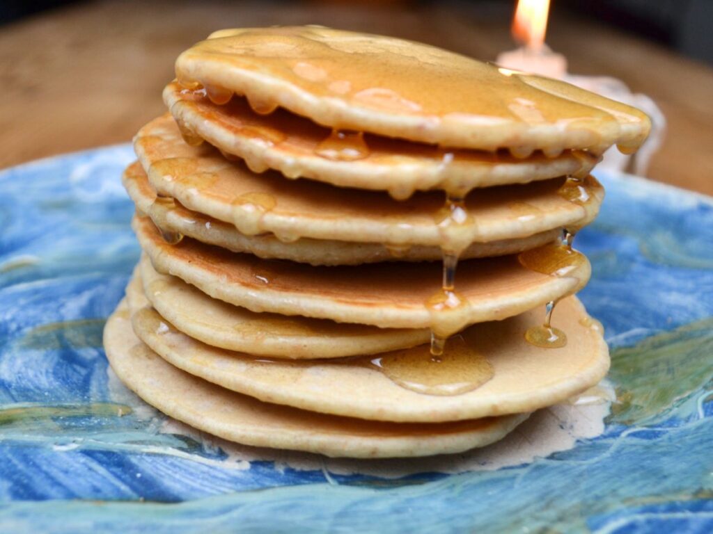 Pancakes on a plate with honey