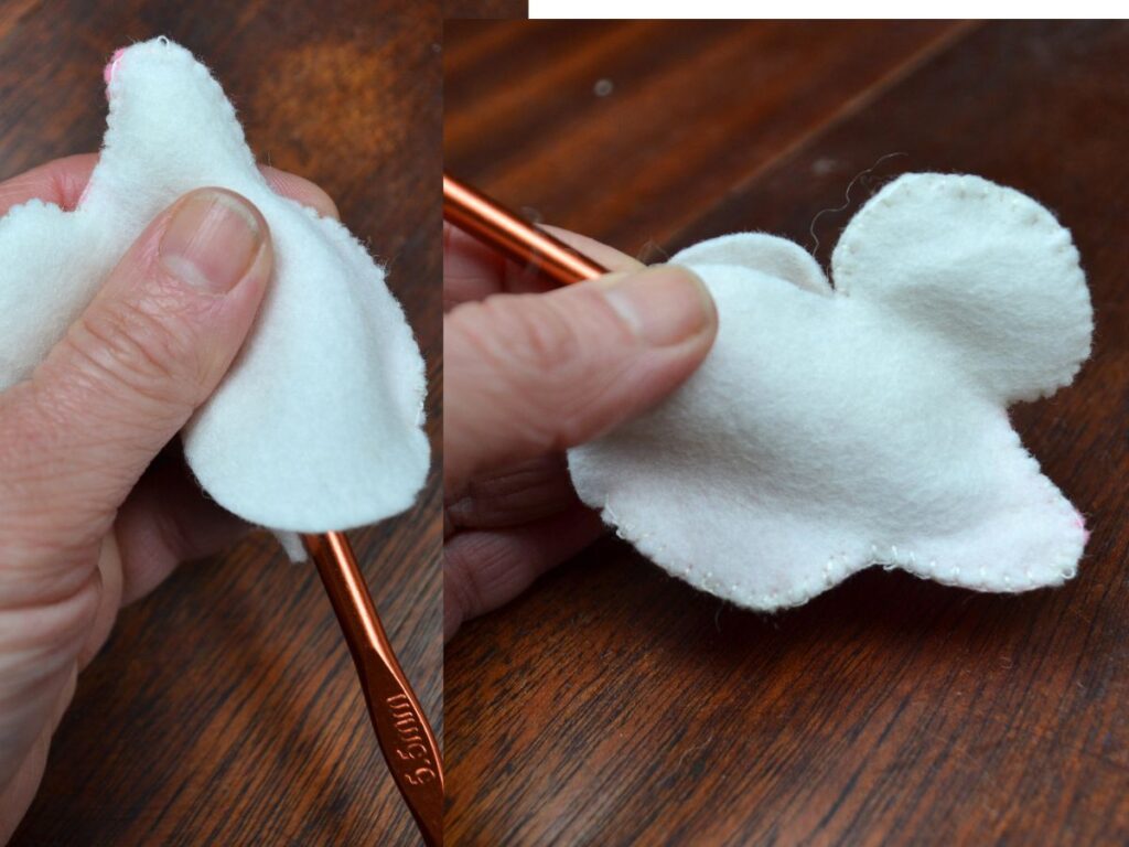 Stuffing a bunny with a crochet needle.