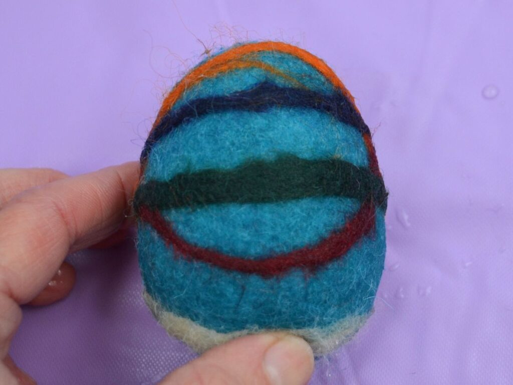 A finished felted Easter egg.