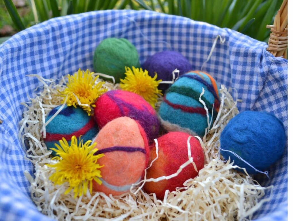 Felted easter eggs on a basket.
