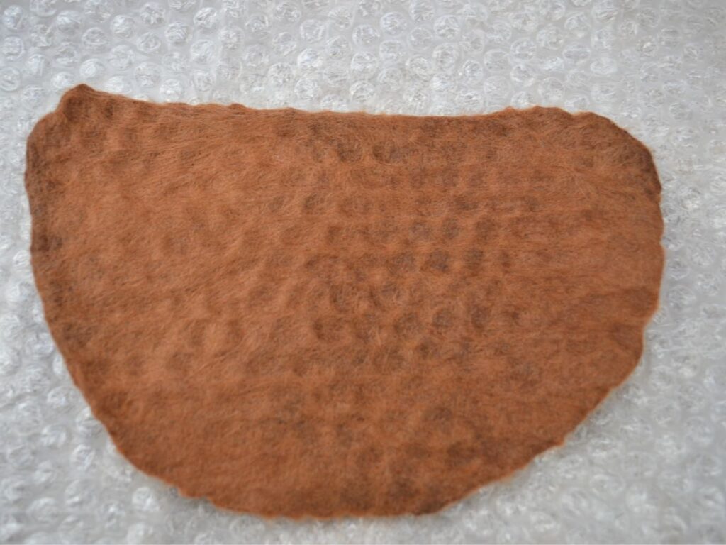 A wet-felted piece in progress.