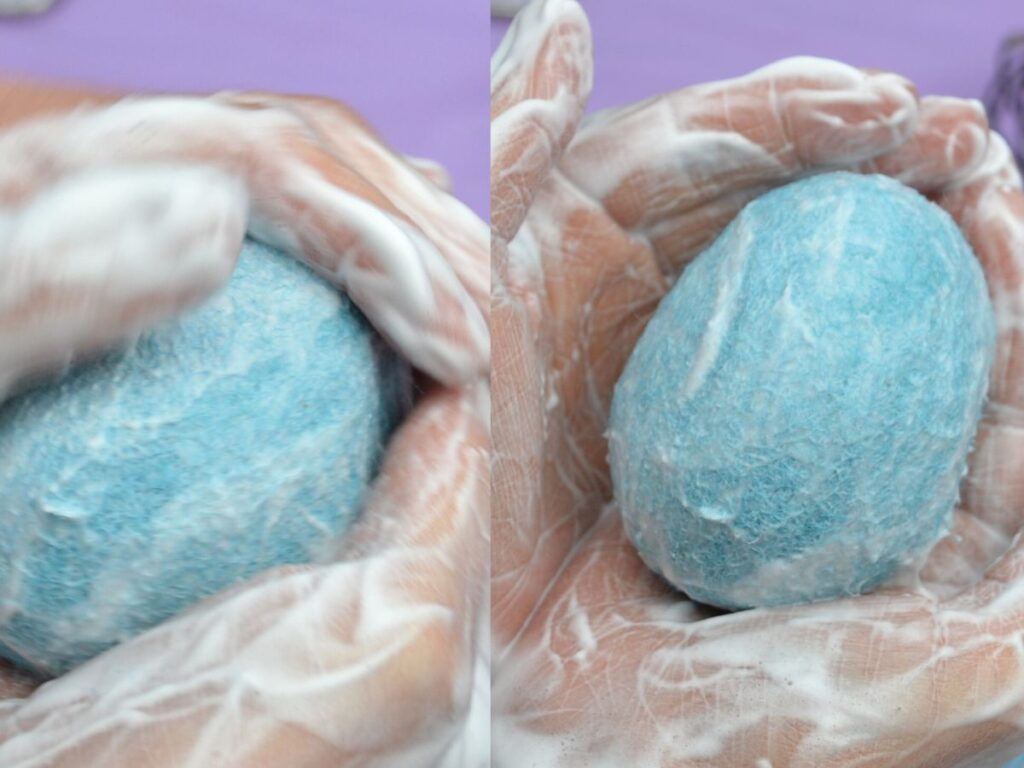 Hands felting a wool easter egg.