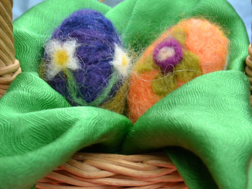 2 Needle felted eggs in a basket