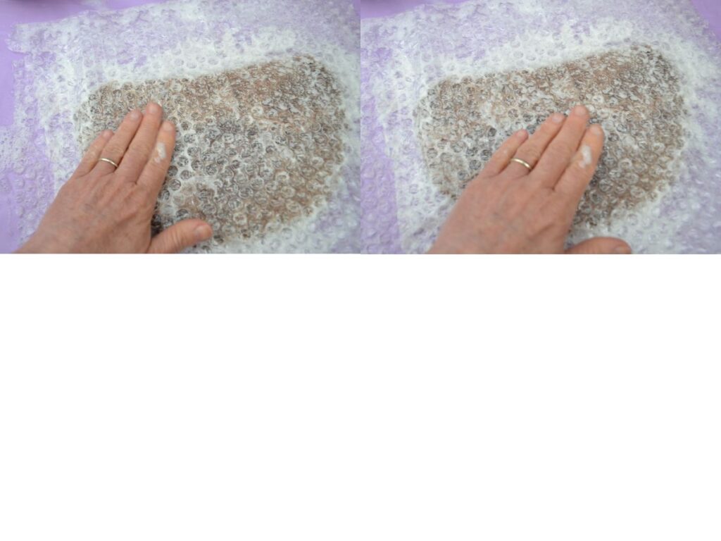 Felting a piece of roving wool.