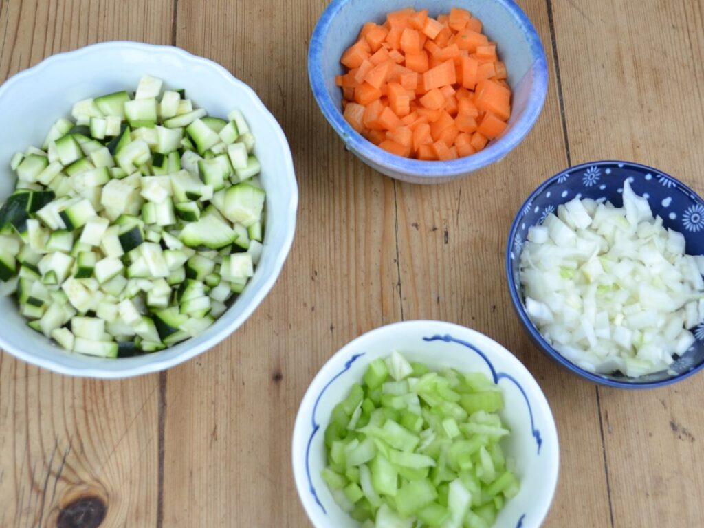 little bowls with different vegetables in them.