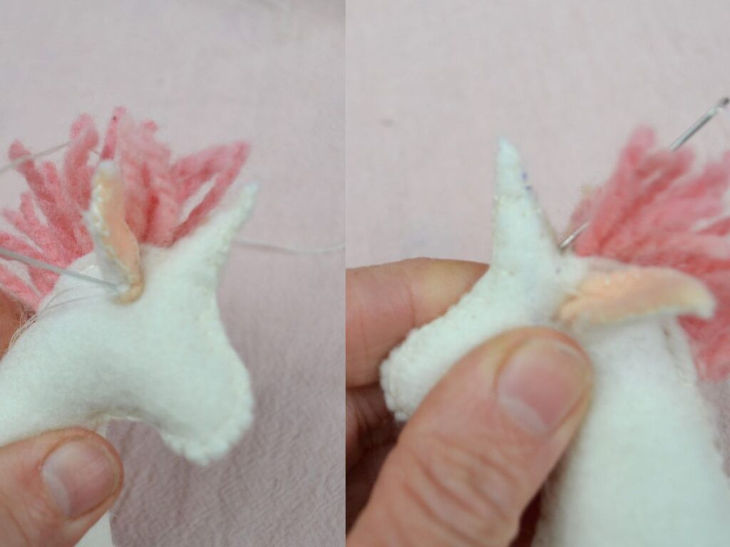 Sewing the ears to a felt Unicorn.