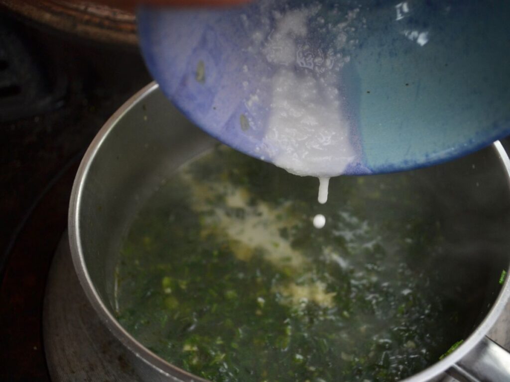 Adding Kuzu to a cooking Miso Nettle Soup.