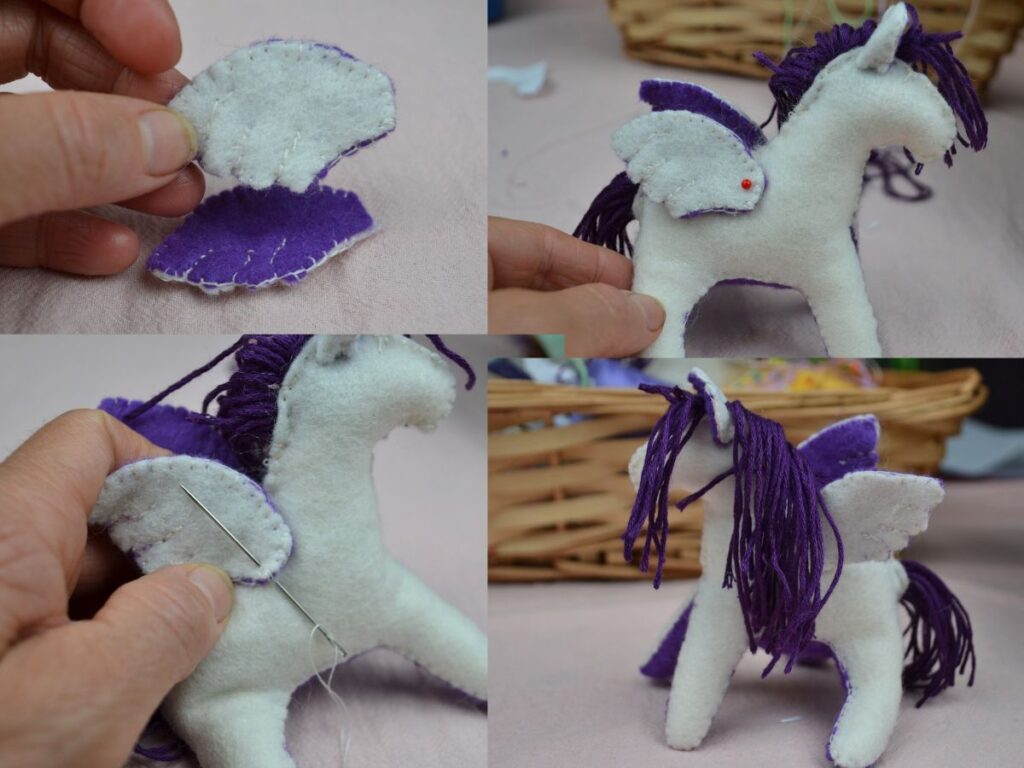 Sewing the wings of a felt pegasus.