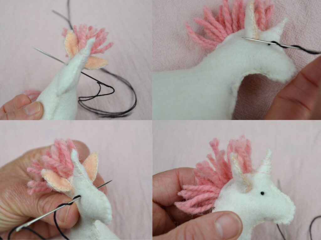 Sewing the eyes of a Felt Unicorn with a French knot.