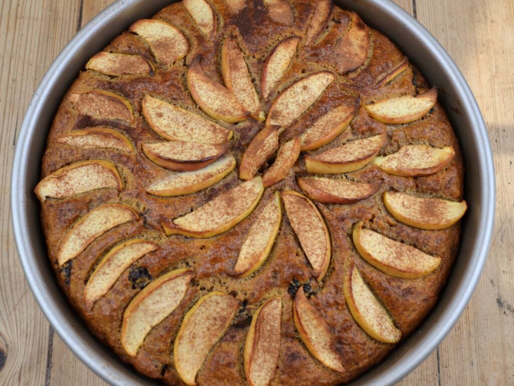 A baked Apple Cake in a cake tin.