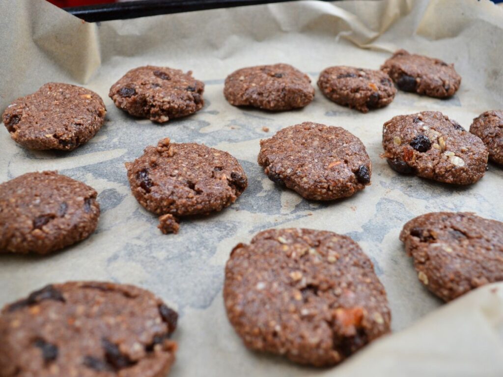 Millet chocolate cookies on parchment paper.