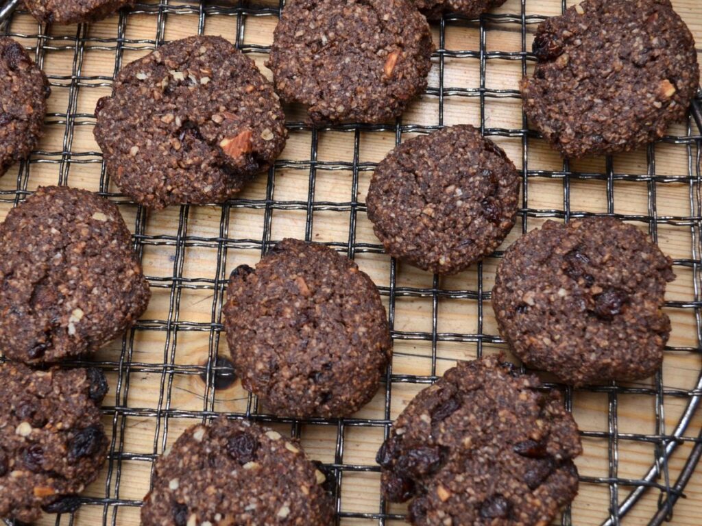 Millet chocolate cookies on a cooling rack.