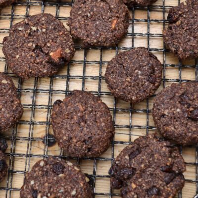 Millet chocolate cookies on a cooling rack.