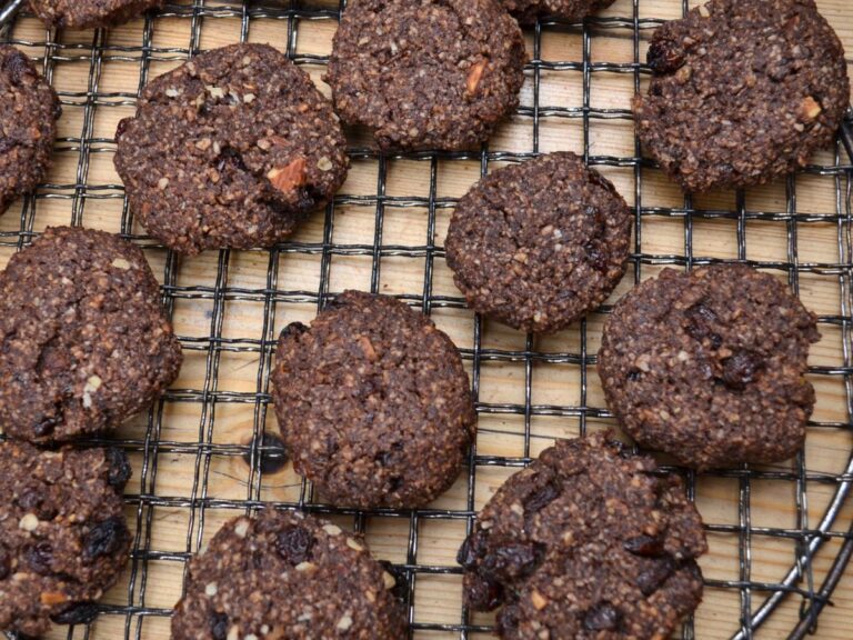 Millet chocolate cookies on a cooling rack.