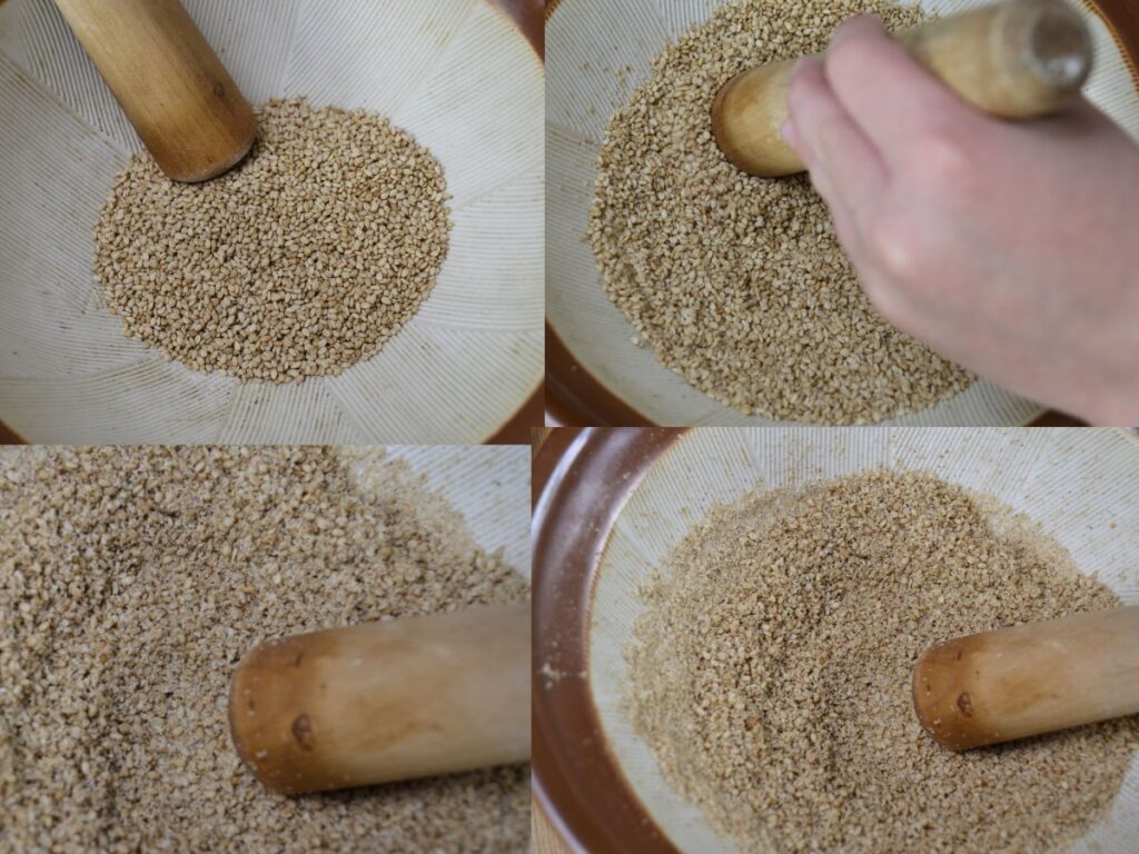 Grinding sesame seeds in a suribache.