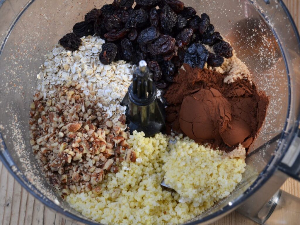 Ingredients for millet chocolate cookies in a food processor.