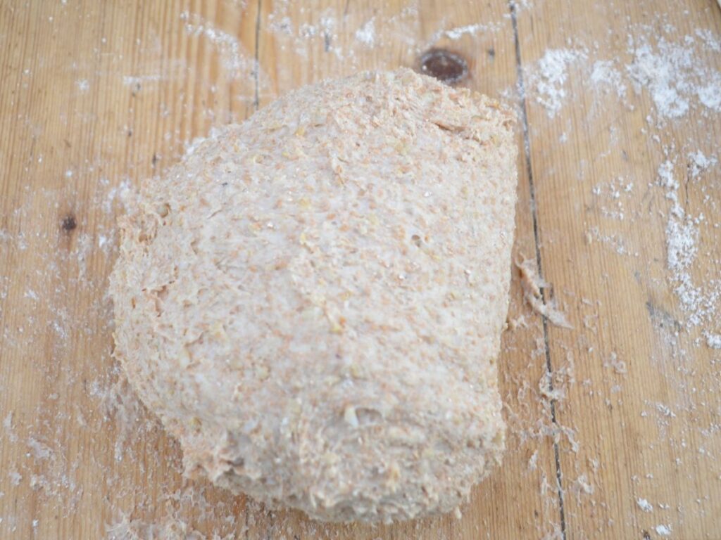 Rice Bread dough on a wooden surface.