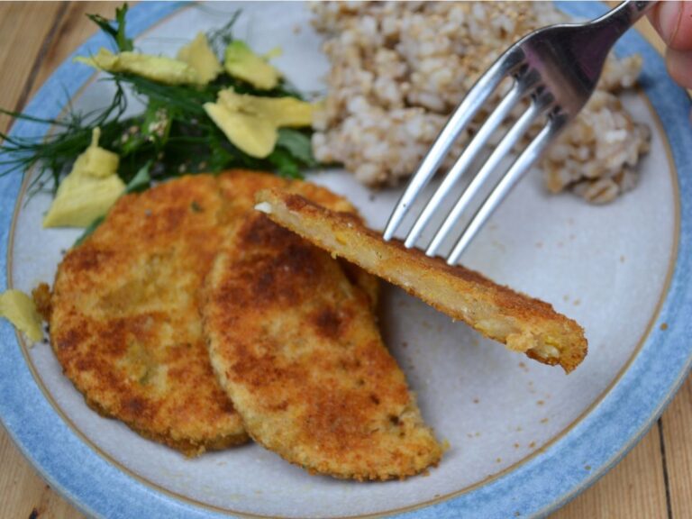 Chickpea Schnitzels in a plate with brown rice and salad.