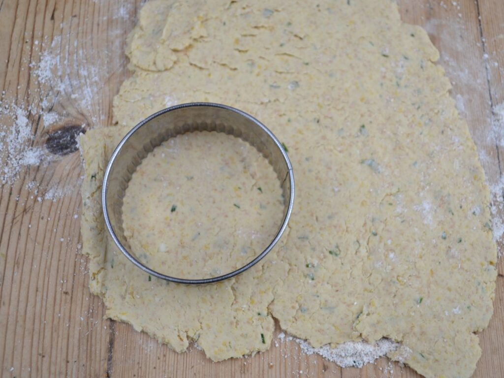 A chickpea Schnitzel dough with a cookie cutter.