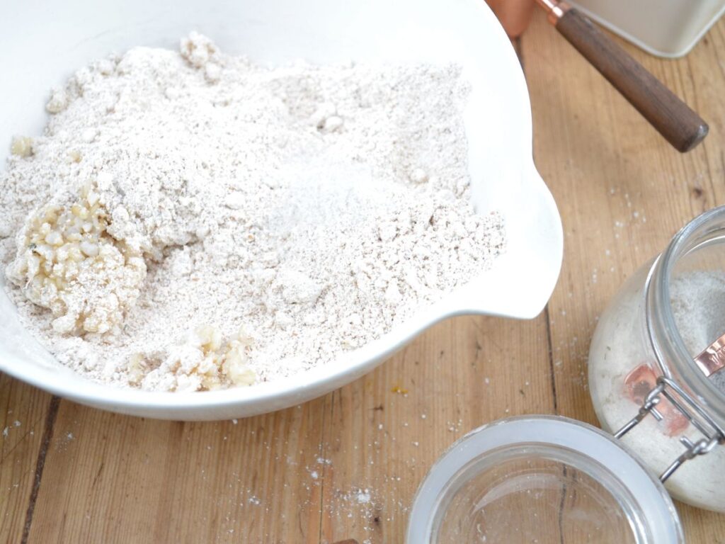 A bowl with ingredients for a rice bread.