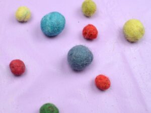 Different colour felt balls.