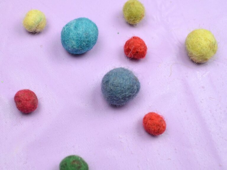 Different colour felt balls.