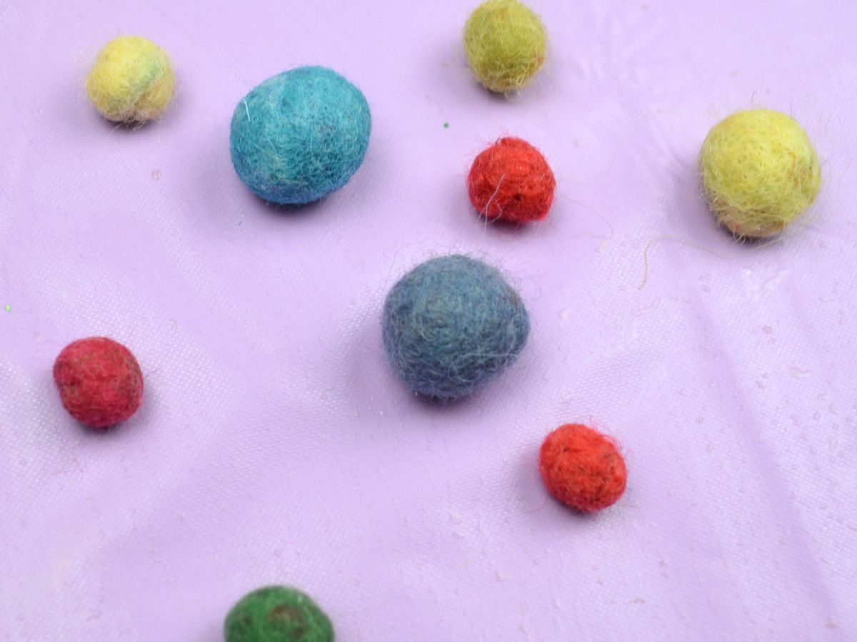 Different colour felt balls.