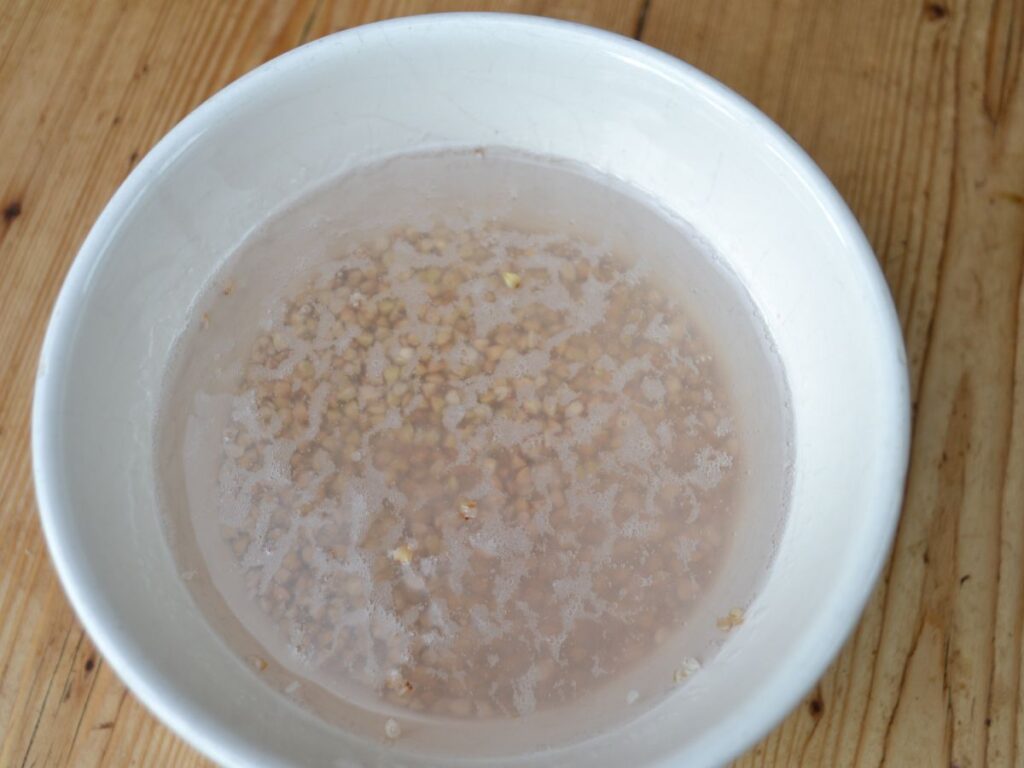 Buckwheat in a bowl, cover with water.