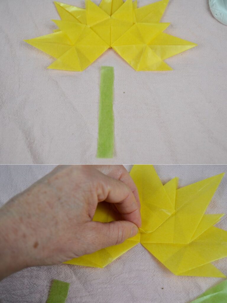 An Autumn paper leaf and a piece of kite paper leaf stick.