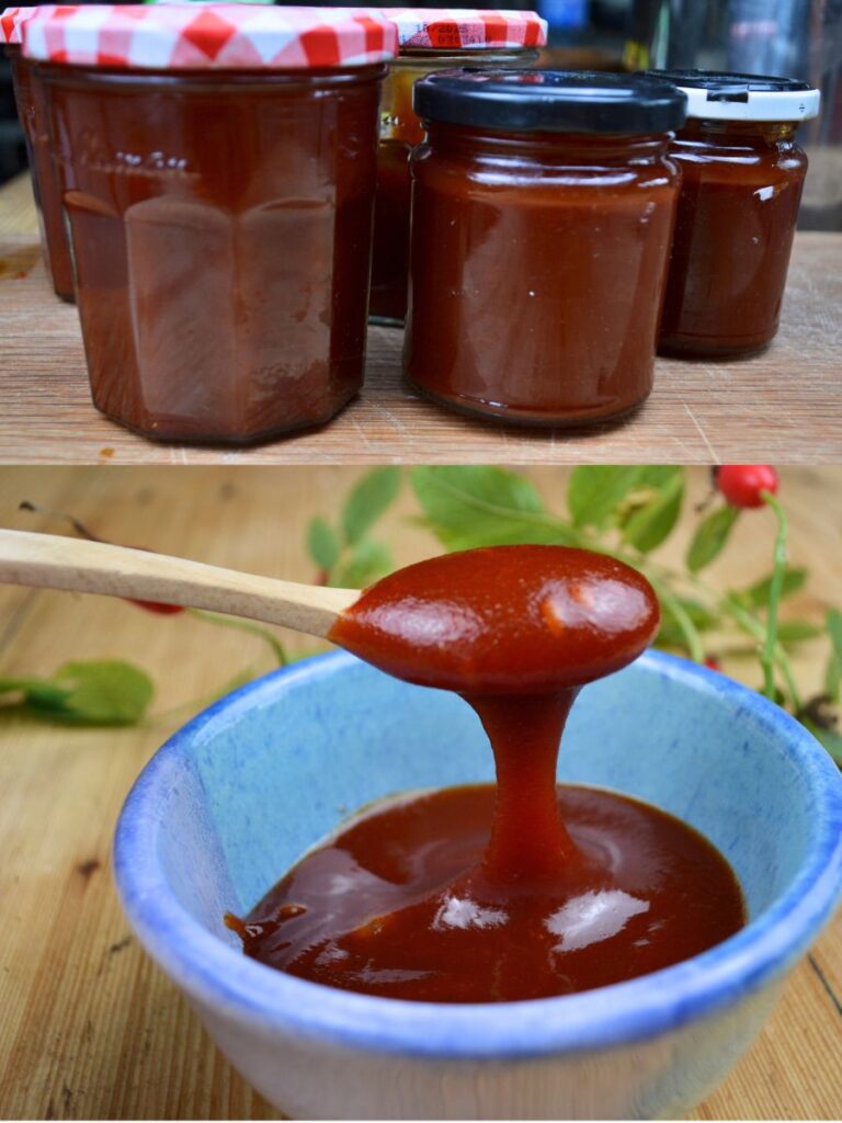 Rosehip jam jars on a wooden board, with a wooden spoon over a bowl of rosehip jam.