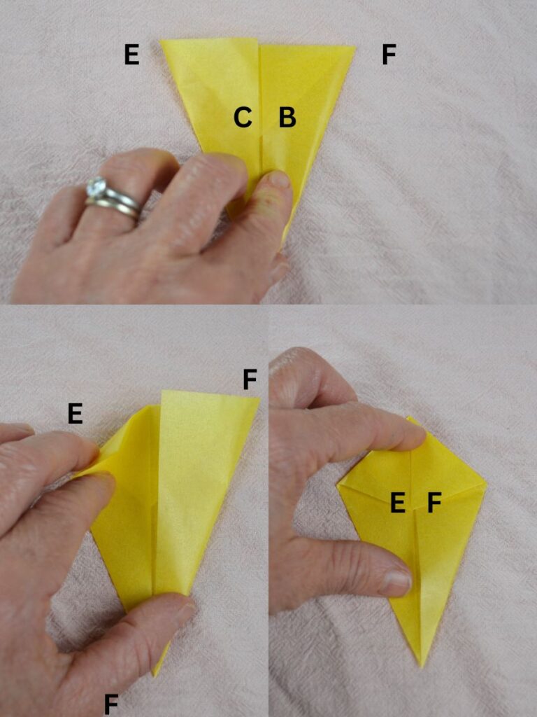 A hand folding points of a kite-shaped piece of kite paper.