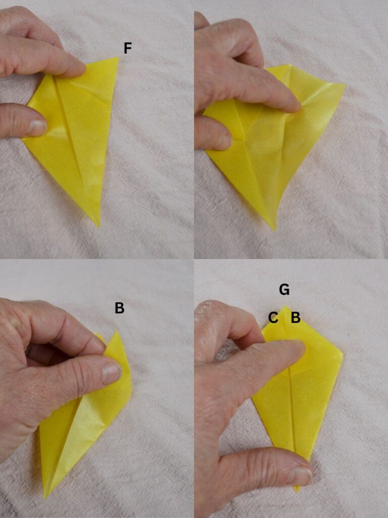 A hand folding points of a kite-shaped piece of kite paper.
