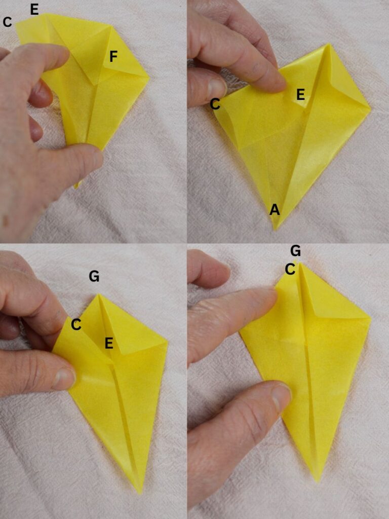 A hand folding points of a kite-shaped piece of kite paper.